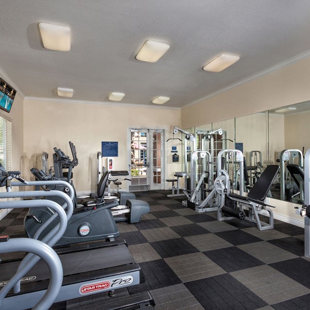 Carmel at Woodcreek West Apartments - Fitness center with treadmills