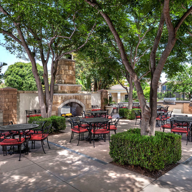 Homecoming at Eastvale Apartments - Outdoor patio and trees