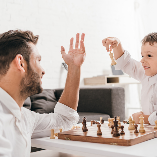 Homecoming At The Resort - Father and Son Playing Chess